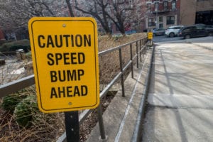 speed bump caution sign 